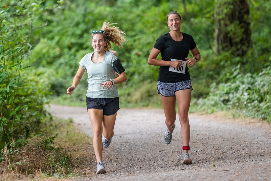 Two runners on the gravel trail around the lake